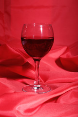 Two Glass of red, white wine on red background