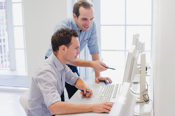business team working together on computer, businessman discussing project in the office