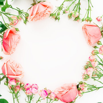 Round frame pattern with roses and leaves isolated on white background. Flat lay, top view