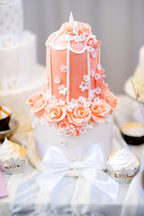 Delicious wedding cake decorated with sugar flowers