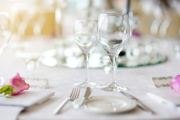 Beautiful table setting with crockery and flowers for a party, wedding reception or other festive event