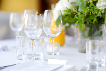 Beautiful table setting with crockery and flowers for a party, wedding reception or other festive event