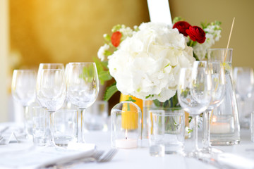 Beautiful table setting with crockery and flowers for a party, wedding reception or other festive event