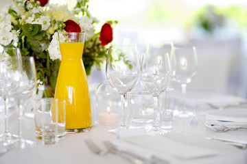 Beautiful table setting with crockery and flowers for a party, wedding reception or other festive event