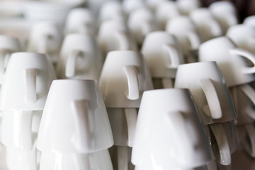 Many rows of pure white coffee cups