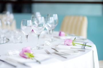 Beautiful table setting with crockery and flowers for a party, wedding reception or other festive event