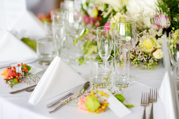Beautiful table setting with crockery and flowers for a party, wedding reception or other festive event