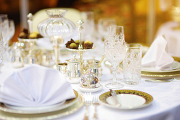 Beautiful table setting with crockery and flowers for a party, wedding reception or other festive event