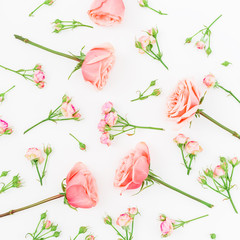 Floral background. Floral pattern made of pink roses on white background. Flat lay, top view.