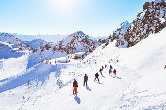 Skiers On Beautiful Ski Slope In Alps, People On  Winter Holidays