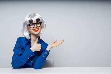 woman showing thumbs up, two-sided glasses