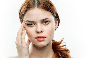 Fototapeta premium woman wiping her eyes with her hand