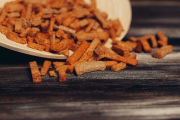 rye croutons with seasoning on a wooden plate