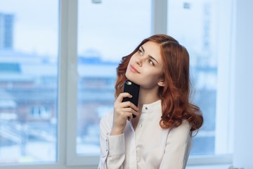 romantic woman holding a phone in her hand