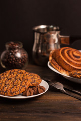 oatmeal cookies and rolls on a plate...