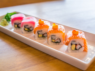 Sushi rolls with salmon, tuna, crabstick and egg, selective focus.