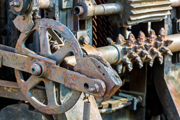 old industrial mechanism closeup. rusty cogwheels and gears.