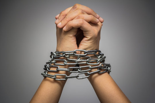 The Woman's Hands Were Tied Up With A Chain/concept. Date Of Cessation Of The Violence Against Women And Children, International November 25.