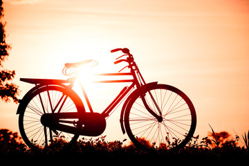 Fototapeta na wymiar beautiful landscape image with Silhouette Bicycle at sunset