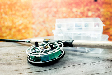 Fototapeta premium fishing spinning rod with reel on the wooden table