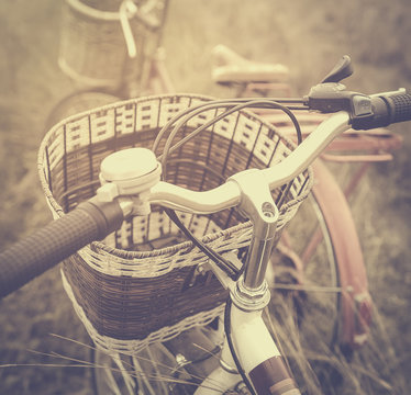 beautiful landscape image with Bicycle at sunset ; vintage filter style