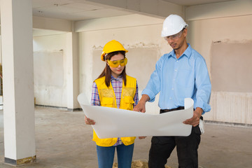 Architect and Constructor Discussion on Building Project Inspection with Architect plan