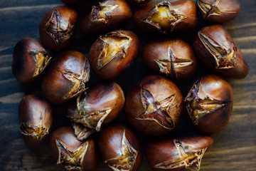 Roasted chestnuts on wooden table