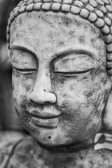 Stunning Buddha statue portrait with shallow depth of field and blurred background