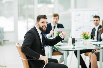 Manager and business team to discuss the presentation of a new financial project in a modern office