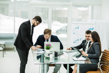 business partners discuss the profits before signing a new contract in the workplace in a modern office