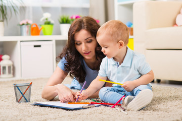 Mother with child playing in the home