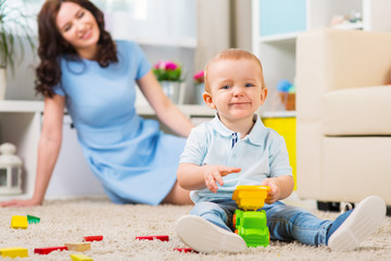 Mother with child playing in the home