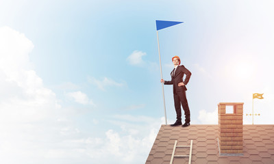 Young businessman with flag presenting concept of leadership. Mi