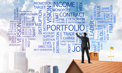 Young businessman standing on house roof and writing leadership skill concept. Mixed media