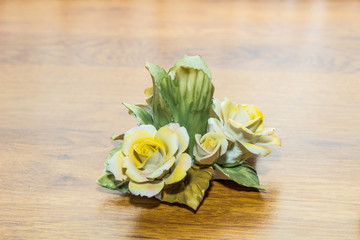 candlestick on wooden background with roses