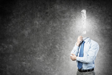 Pensive headless businessman