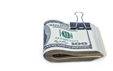 Pile of one hundred dollar bills isolated on white background