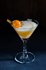 Idea for decoration refreshing cold cocktail with cinnamon and gooseberry