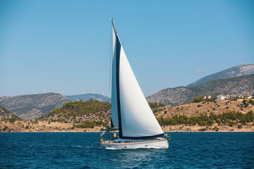 Fototapeta na wymiar Sailing yacht in the Sea. Luxury boats.