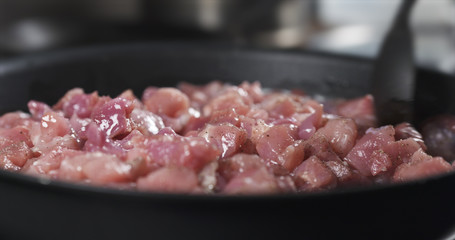 mixing pork meat frying on pan cooking pilaf, 4k photo