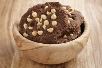 homemade chocolate cookies with chocolate chips and hazelnuts, shallow focus