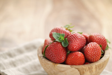 fresh strawberries in bowl on napkin on table, organic garden berries