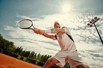 Zelfklevend Fotobehang Tennis player playing tennis © luckybusiness
