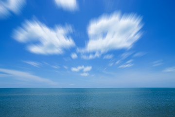 Fototapeta na wymiar Motion of white cloud over the sea.
