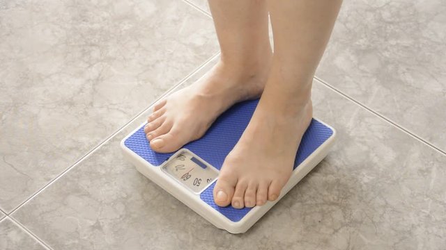 measuring her weight