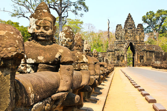 South gate to angkor thom in Cambodia is lined with warriors and demons