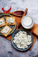 Cracker cookies with cottage cheese and glass of milk