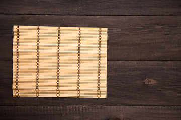 wooden mat on wooden background
