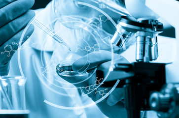 Conical flask in scientist hand with lab glassware background, L