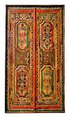 Very old ethnic vintage wooden window with closed shutters, isolated on white.